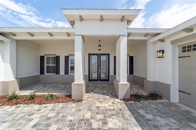 10553 SW 98th Pl, Ocala, FL 34481 - view of exterior entry with french doors and stucco siding