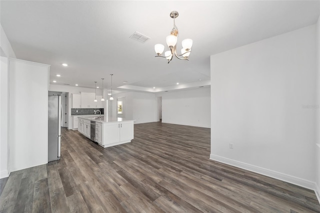 10553 SW 98th Pl, Ocala, FL 34481 - kitchen with a sink, open floor plan, recessed lighting, dark wood-style flooring, and light countertops