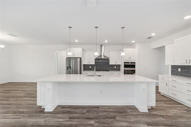 10553 SW 98th Pl, Ocala, FL 34481 - kitchen featuring appliances with stainless steel finishes, wall chimney exhaust hood, a sink, decorative backsplash, and recessed lighting