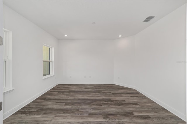 10553 SW 98th Pl, Ocala, FL 34481 - spare room featuring dark wood-type flooring, recessed lighting, and baseboards