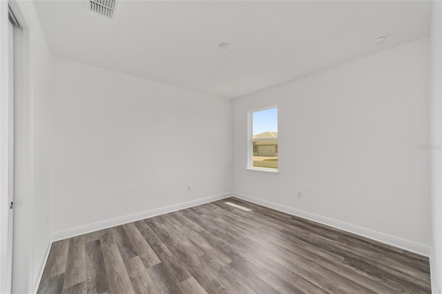 10553 SW 98th Pl, Ocala, FL 34481 - unfurnished room with dark wood-type flooring and baseboards