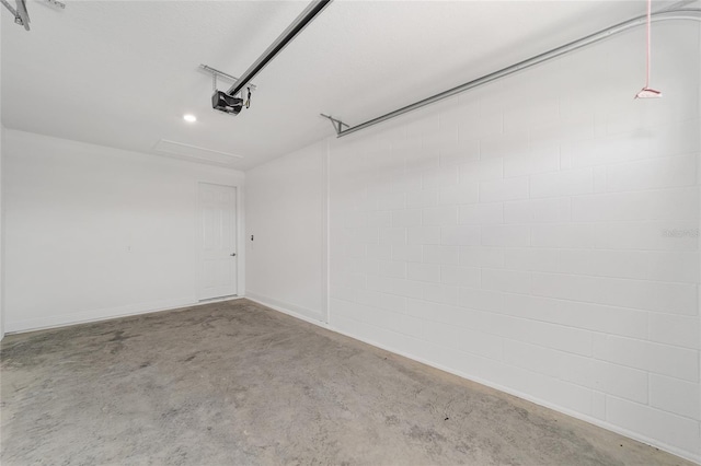 10553 SW 98th Pl, Ocala, FL 34481 - garage featuring a garage door opener and recessed lighting