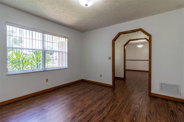 3295 SE 56th Ave, Ocala, FL 34480 - spare room with wood finished floors, baseboards, and a textured ceiling