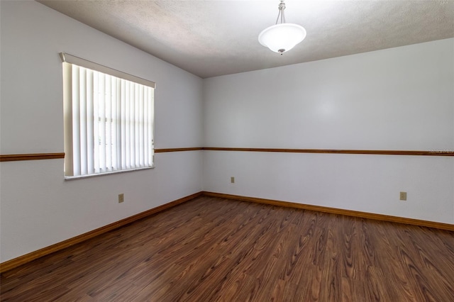 3295 SE 56th Ave, Ocala, FL 34480 - empty room featuring dark wood-style floors and baseboards