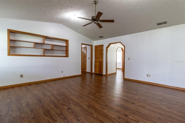 3295 SE 56th Ave, Ocala, FL 34480 - spare room featuring ceiling fan, dark wood-type flooring, lofted ceiling, arched walkways, and baseboards
