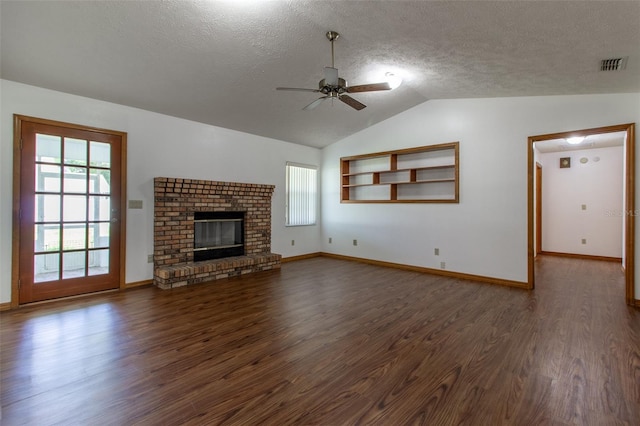 3295 SE 56th Ave, Ocala, FL 34480 - unfurnished living room with dark wood-style flooring, a ceiling fan, lofted ceiling, a textured ceiling, and baseboards