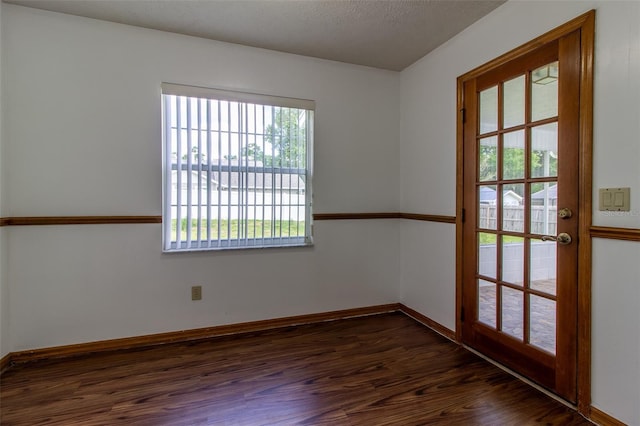 3295 SE 56th Ave, Ocala, FL 34480 - empty room featuring dark wood-style flooring and baseboards