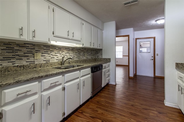 3295 SE 56th Ave, Ocala, FL 34480 - kitchen featuring a sink, dishwasher, decorative backsplash, dark wood-type flooring, and a textured ceiling