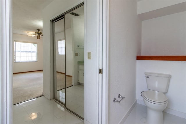 3295 SE 56th Ave, Ocala, FL 34480 - bathroom featuring toilet, baseboards, ceiling fan, and tile patterned floors