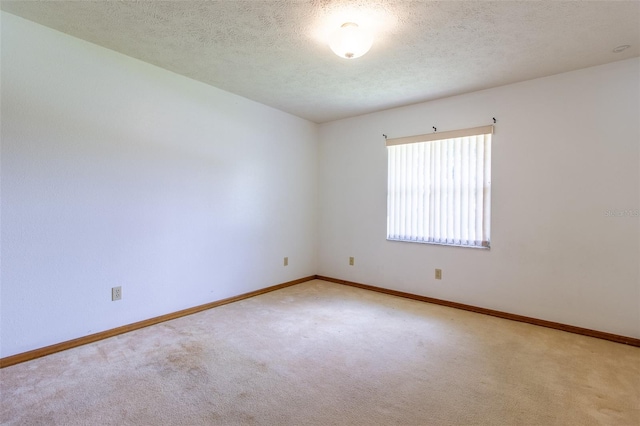 3295 SE 56th Ave, Ocala, FL 34480 - unfurnished room with carpet flooring, baseboards, and a textured ceiling