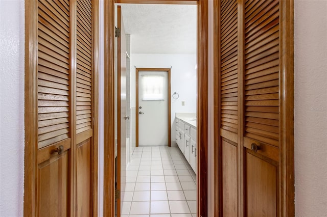 3295 SE 56th Ave, Ocala, FL 34480 - bathroom with a closet, tile patterned floors, vanity, and a textured ceiling