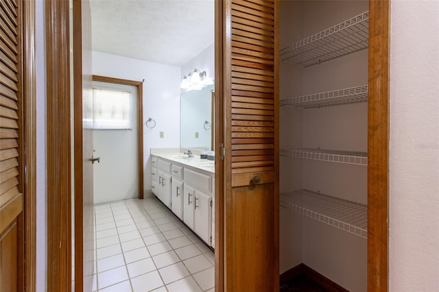 3295 SE 56th Ave, Ocala, FL 34480 - bathroom with double vanity, tile patterned flooring, and a closet