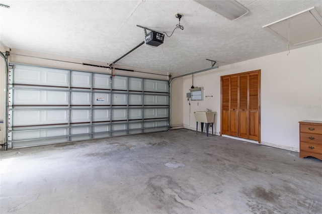 3295 SE 56th Ave, Ocala, FL 34480 - garage featuring a garage door opener and a sink