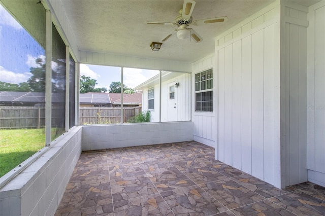 3295 SE 56th Ave, Ocala, FL 34480 - unfurnished sunroom with a ceiling fan
