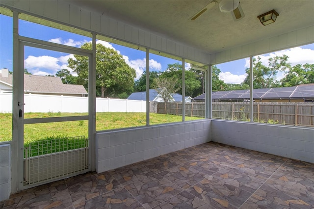 3295 SE 56th Ave, Ocala, FL 34480 - unfurnished sunroom featuring a ceiling fan