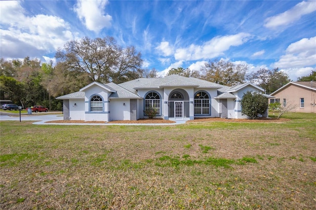 8015 N Tower Way, Citrus Springs, FL 34434 - view of front facade with a front lawn and stucco siding