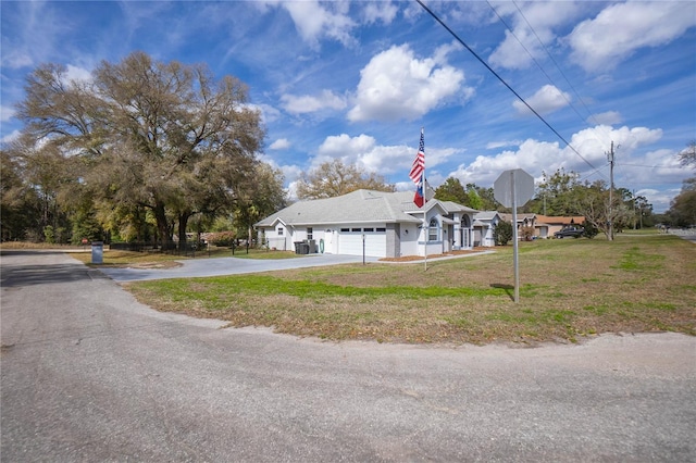 8015 N Tower Way, Citrus Springs, FL 34434 - view of front of property with driveway, a garage, and a front yard