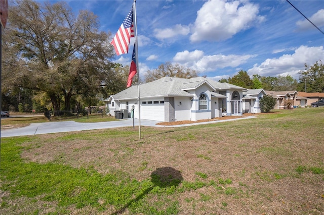 8015 N Tower Way, Citrus Springs, FL 34434 - view of front facade with driveway, an attached garage, roof with shingles, and stucco siding