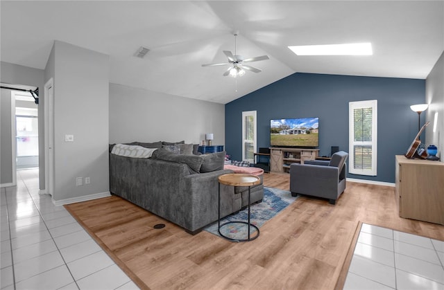 8015 N Tower Way, Citrus Springs, FL 34434 - living area featuring ceiling fan, lofted ceiling, light tile patterned flooring, and baseboards
