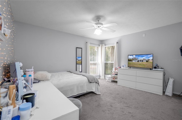 8015 N Tower Way, Citrus Springs, FL 34434 - bedroom with carpet flooring and a ceiling fan