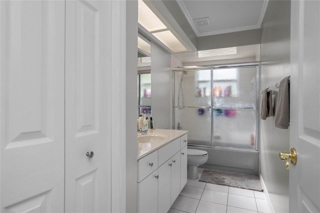 8015 N Tower Way, Citrus Springs, FL 34434 - bathroom with toilet, vanity, tile patterned floors, shower / bath combination with glass door, and ornamental molding