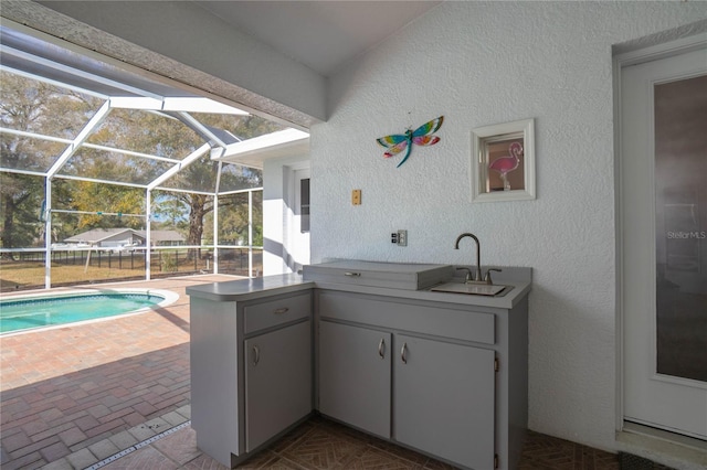 8015 N Tower Way, Citrus Springs, FL 34434 - view of patio with a sink, area for grilling, a lanai, and an outdoor pool