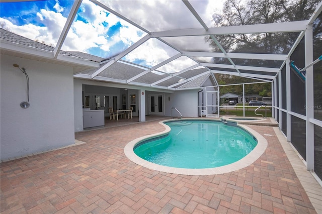 8015 N Tower Way, Citrus Springs, FL 34434 - view of pool with french doors, a patio area, a pool with connected hot tub, and a lanai