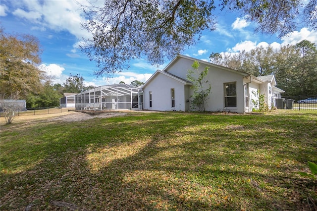 8015 N Tower Way, Citrus Springs, FL 34434 - rear view of property featuring stucco siding, a lanai, and cooling unit