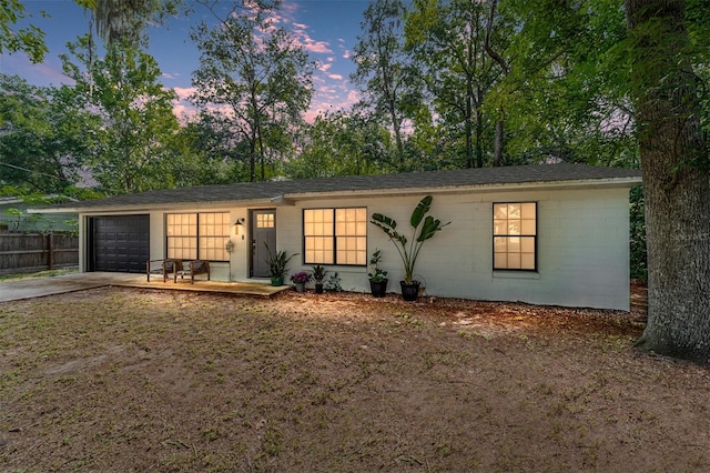4601 SE 18th Ave, Ocala, FL 34480 - ranch-style house featuring concrete driveway, an attached garage, and concrete block siding