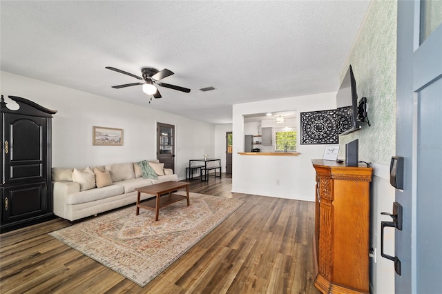 4601 SE 18th Ave, Ocala, FL 34480 - living area featuring dark wood finished floors, ceiling fan, and a textured ceiling