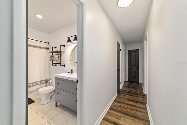 4601 SE 18th Ave, Ocala, FL 34480 - hall with baseboards, a sink, and light wood finished floors