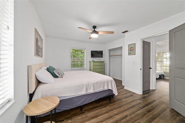 4601 SE 18th Ave, Ocala, FL 34480 - bedroom with dark wood-type flooring, multiple windows, ceiling fan, and a closet