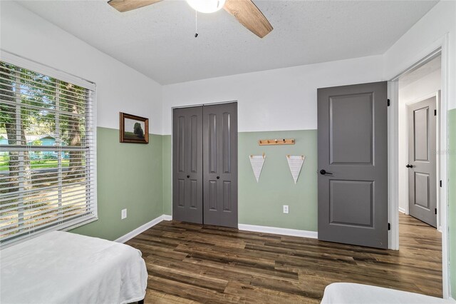 4601 SE 18th Ave, Ocala, FL 34480 - bedroom with wood finished floors, a closet, baseboards, and ceiling fan