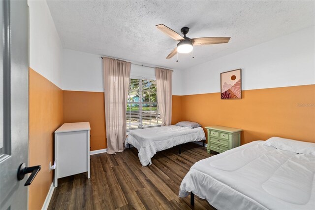 4601 SE 18th Ave, Ocala, FL 34480 - bedroom featuring wood finished floors, a textured ceiling, baseboards, and a ceiling fan