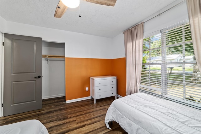 4601 SE 18th Ave, Ocala, FL 34480 - bedroom featuring wood finished floors, a textured ceiling, a closet, baseboards, and ceiling fan