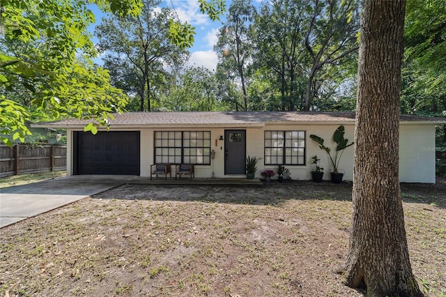 4601 SE 18th Ave, Ocala, FL 34480 - view of front of home featuring concrete block siding, driveway, a garage, and roof with shingles