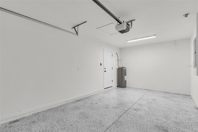 5701 NW 6th Pl, Ocala, FL 34482 - garage featuring electric water heater and a garage door opener