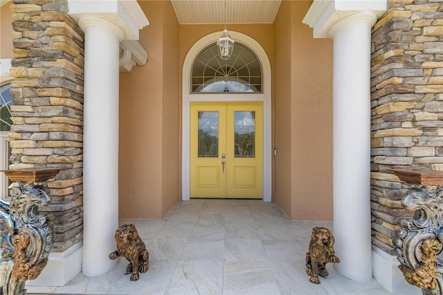 6573 S Magnolia Ave, Ocala, FL 34471 - doorway to property with stone siding, stucco siding, and french doors