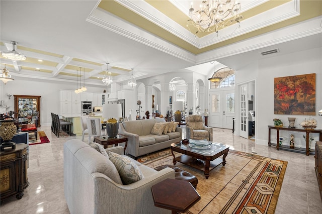 6573 S Magnolia Ave, Ocala, FL 34471 - living area featuring a chandelier, ornate columns, coffered ceiling, a towering ceiling, and baseboards