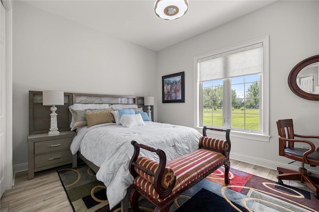 6573 S Magnolia Ave, Ocala, FL 34471 - bedroom with light wood finished floors and baseboards