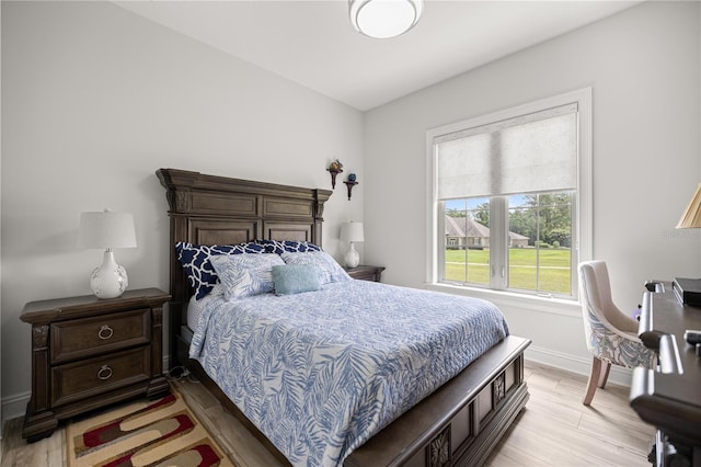 6573 S Magnolia Ave, Ocala, FL 34471 - bedroom with baseboards and light wood-type flooring