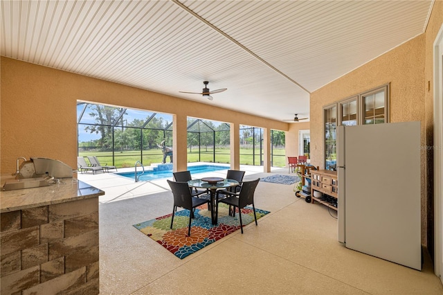 6573 S Magnolia Ave, Ocala, FL 34471 - sunroom / solarium with a ceiling fan and outdoor dining space