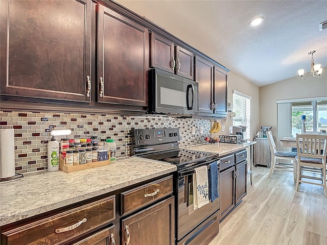 6812 Gideon Cir, Zephyrhills, FL 33541 - kitchen with black appliances, vaulted ceiling, a textured ceiling, backsplash, and dark brown cabinets