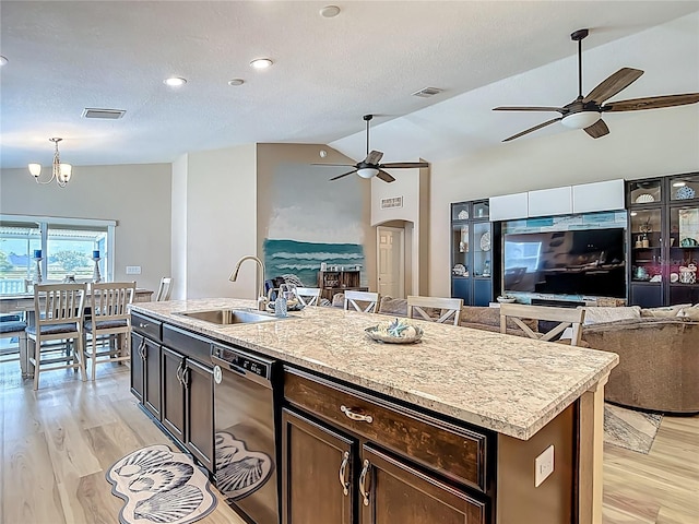 6812 Gideon Cir, Zephyrhills, FL 33541 - kitchen with black dishwasher, a sink, a ceiling fan, open floor plan, and vaulted ceiling