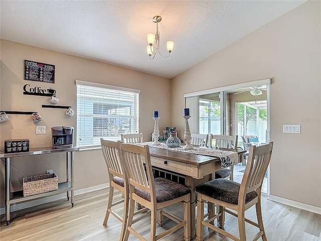 6812 Gideon Cir, Zephyrhills, FL 33541 - dining space featuring light wood-type flooring, a chandelier, and baseboards