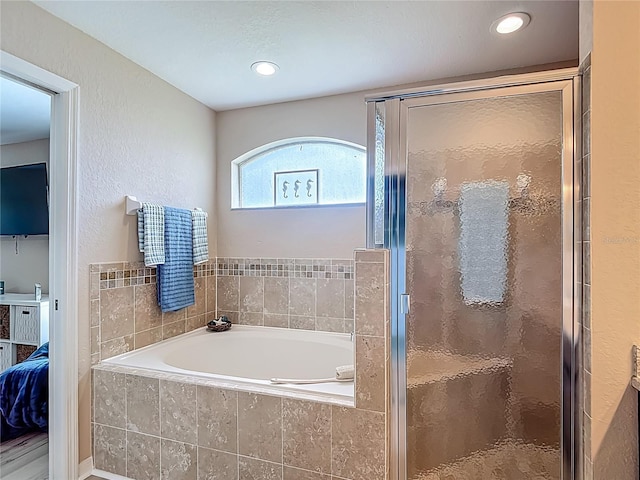 6812 Gideon Cir, Zephyrhills, FL 33541 - full bath featuring a garden tub, a shower stall, ensuite bathroom, and recessed lighting