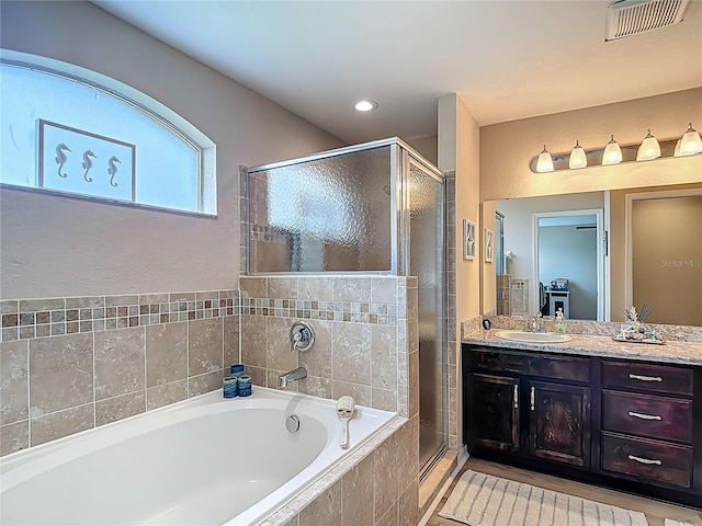 6812 Gideon Cir, Zephyrhills, FL 33541 - full bath featuring a shower stall, a bath, vanity, and recessed lighting