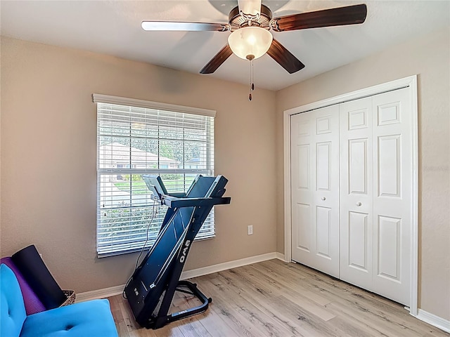 6812 Gideon Cir, Zephyrhills, FL 33541 - workout area featuring baseboards, light wood-type flooring, and a ceiling fan
