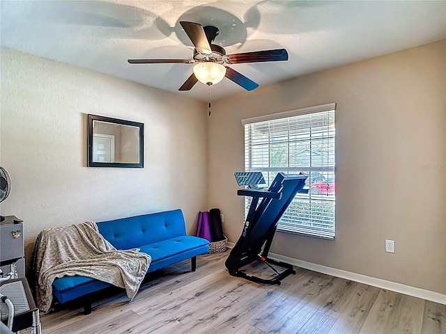 6812 Gideon Cir, Zephyrhills, FL 33541 - exercise room featuring wood finished floors, ceiling fan, and baseboards