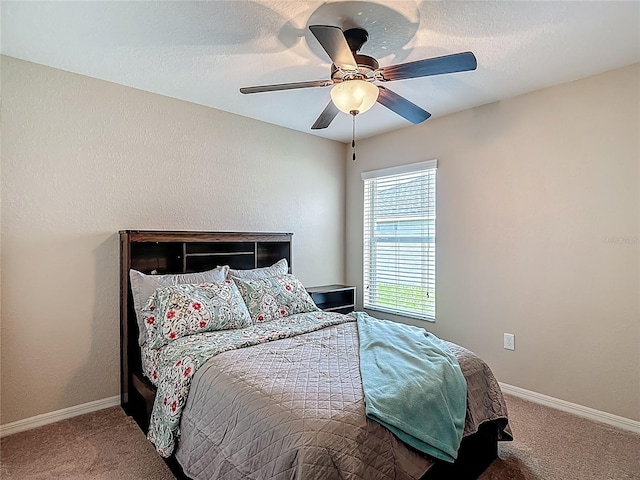 6812 Gideon Cir, Zephyrhills, FL 33541 - carpeted bedroom featuring baseboards and a ceiling fan